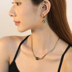 Women's jewelry set with four-leaf clover pendant and stud earrings