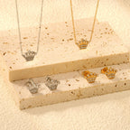 Women’s jewelry set with crown pendants and elegant stud earrings