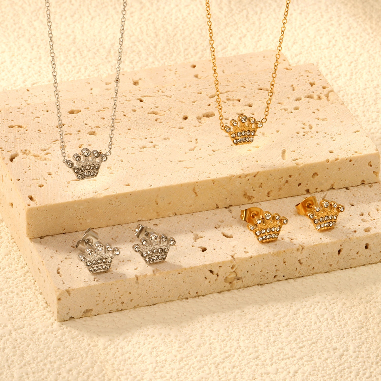 Women’s jewelry set with crown pendants and elegant stud earrings