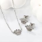 Women’s jewelry set with crown pendants and elegant stud earrings