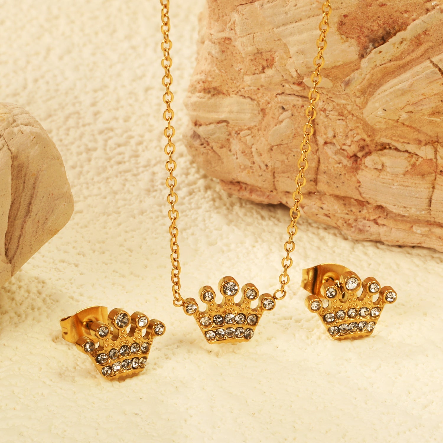 Women’s jewelry set with crown pendants and elegant stud earrings